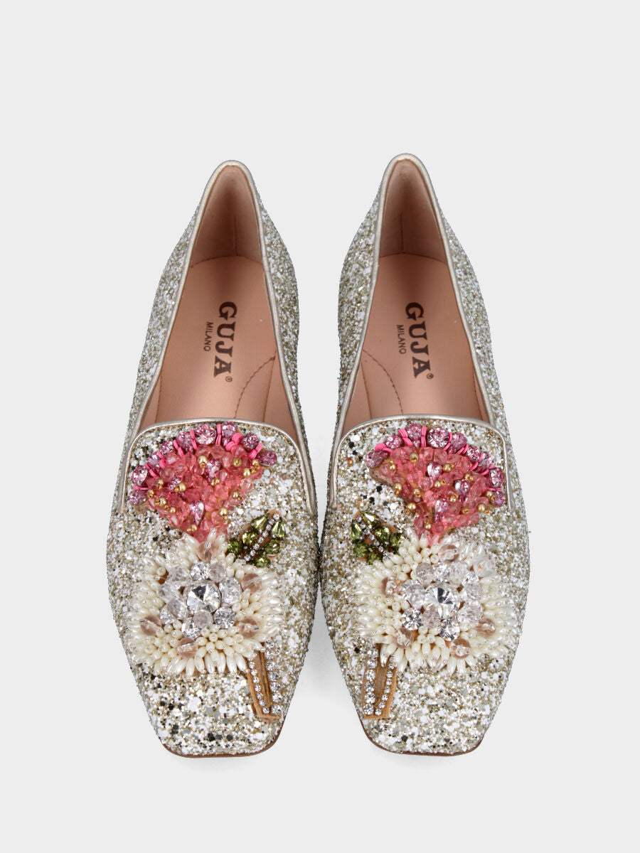 Ballerina con glitter platino e applicazioni ornamentali sulla pianta